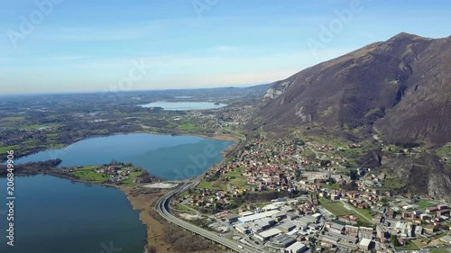 A panoramic aerial view of lake Oggiono from drone photo