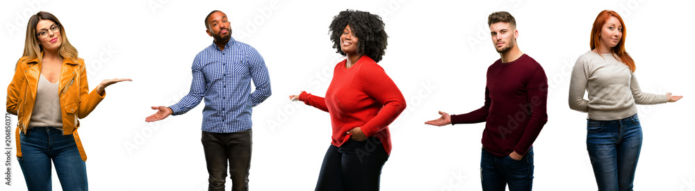 Group of cool people, woman and man confident and happy with a big natural smile inviting to enter Group of cool people, woman and man confident and happy with a big natural smile inviting to enter