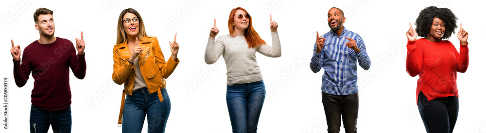 Group of cool people, woman and man happy and surprised cheering pointing up Group of cool people, woman and man happy and surprised cheering pointing up