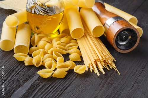 Pasta collection on rustic wooden background dark