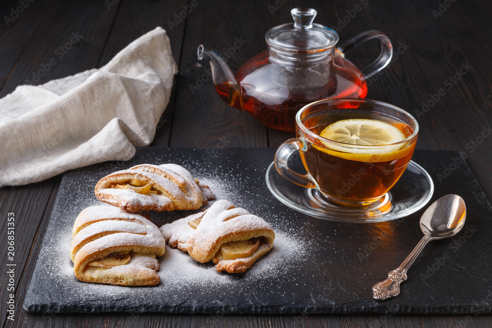 Croissants and tea on a dark background Croissants and tea on a dark background