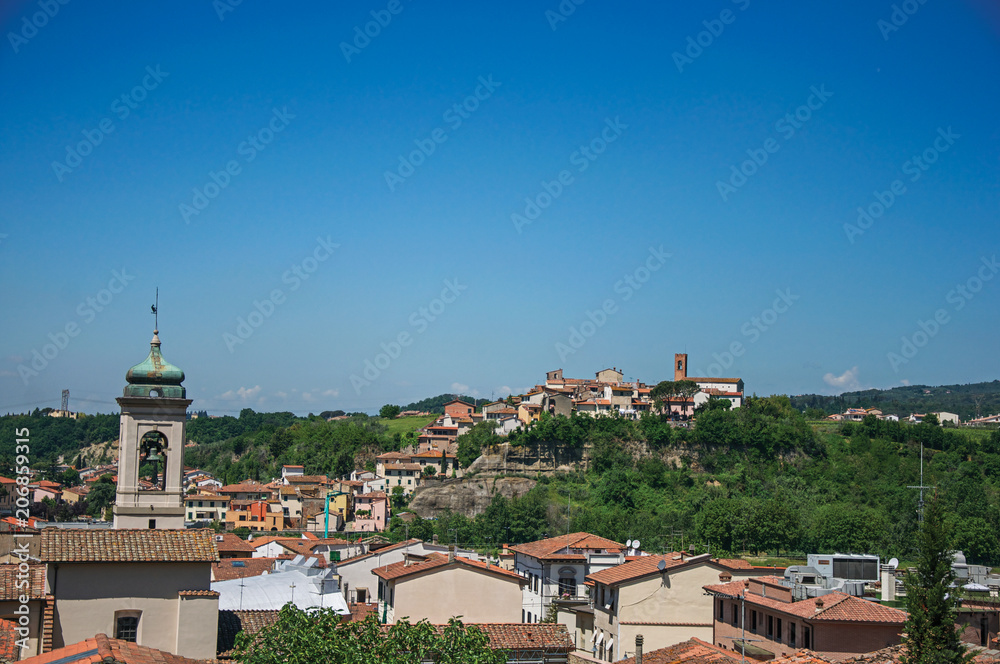 Overview of bell tower and buildings on top of the hill in the center of Montelupo Fiorentino, a nice town near Florence, known for its ceramic products. Located in the Tuscany region