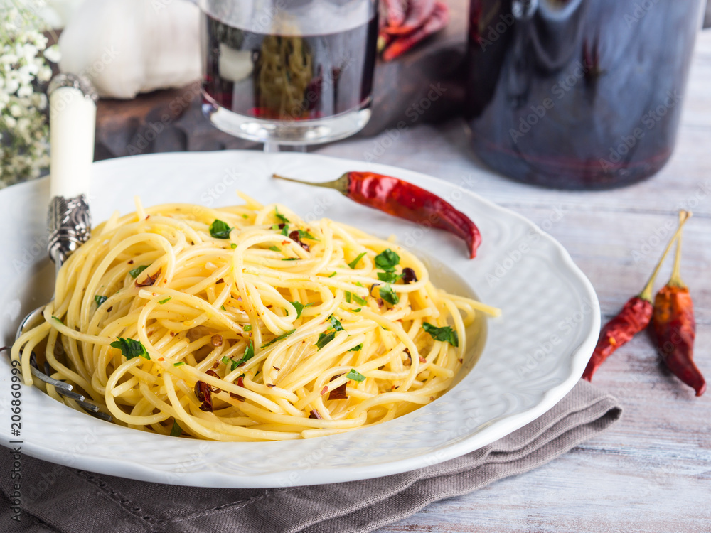 Spaghetti with spicy red pepper, garlic, olive oil. Traditional Italian pasta dish Spaghetti with spicy red pepper, garlic, olive oil. Traditional Italian pasta dish
