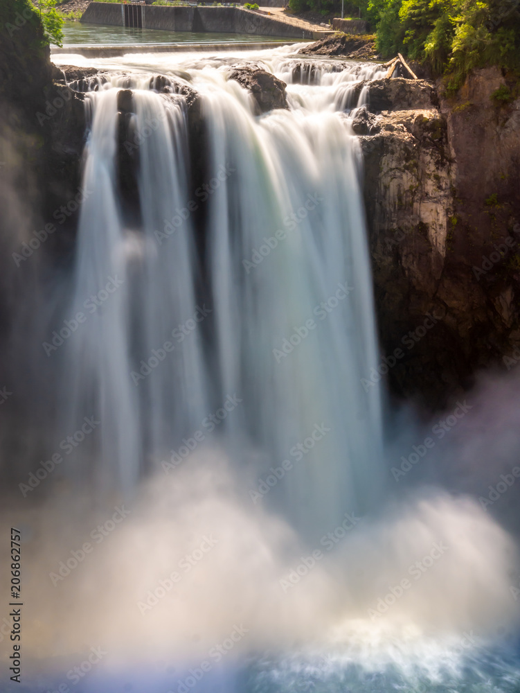 A long exposure of Snoqualmie Falls from the middle observation deck creates an image of silky water going over the falls. A long exposure of Snoqualmie Falls from the middle observation deck creates an image of silky water going over the falls.