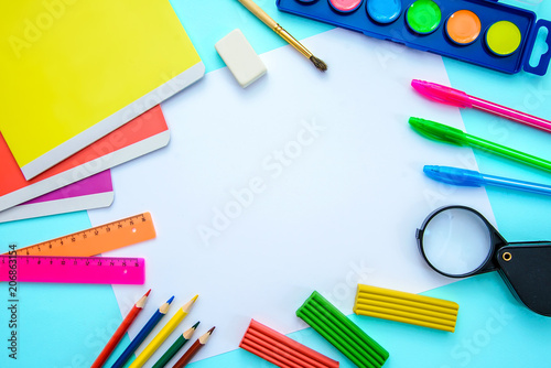 Layout of school subjects with a piece of paper, top view