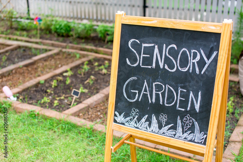 Chalk board next to the garden bed