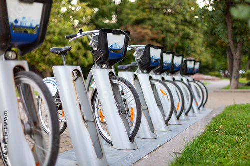 Bicycle rental station on city street. photo