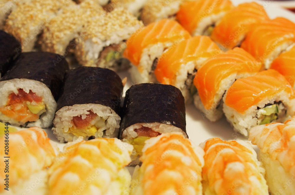 Philadelphia roll sushi with salmon, smoked eel, cucumber, avocado, cream cheese, red caviar. Sushi menu. Japanese food. Healthy food
Philadelphia roll sushi with salmon, smoked eel, cucumber, avocado, cream cheese, red caviar. Sushi menu. Japanese food. Healthy food