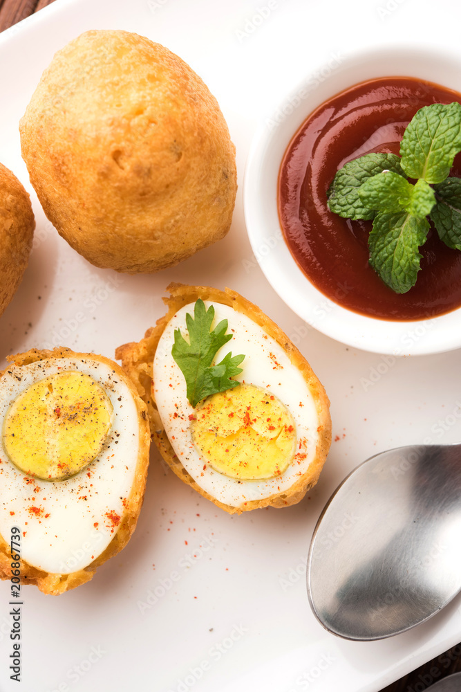 Tasty Egg Pakora or Pakoda served with tomato ketchup Tasty Egg Pakora or Pakoda served with tomato ketchup