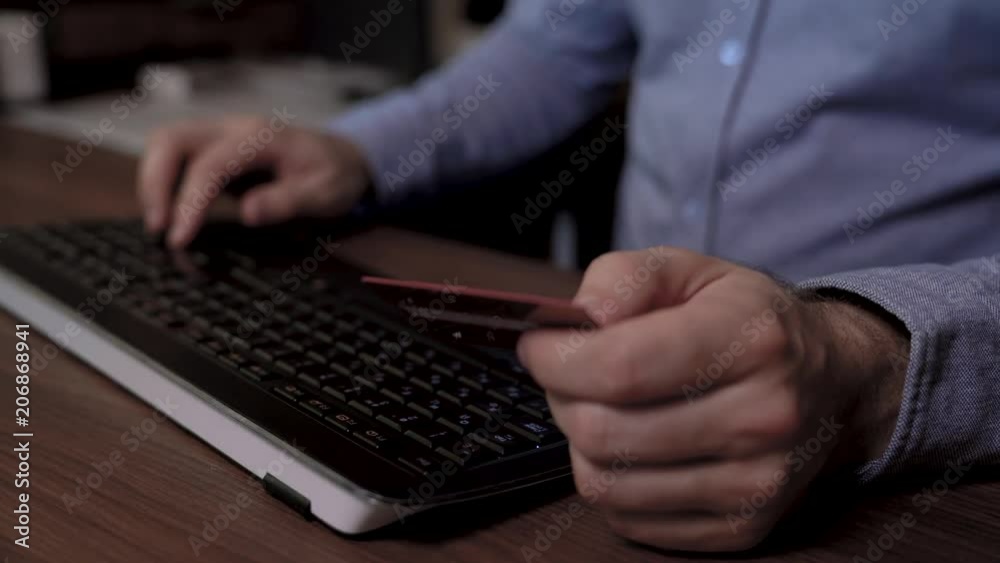 Close up of a businessman hands. He enters text on the keyboard and then uses his credit card to pay online. Slider footage video. Close up of a businessman hands. He enters text on the keyboard and then uses his credit card to pay online. Slider footage video.