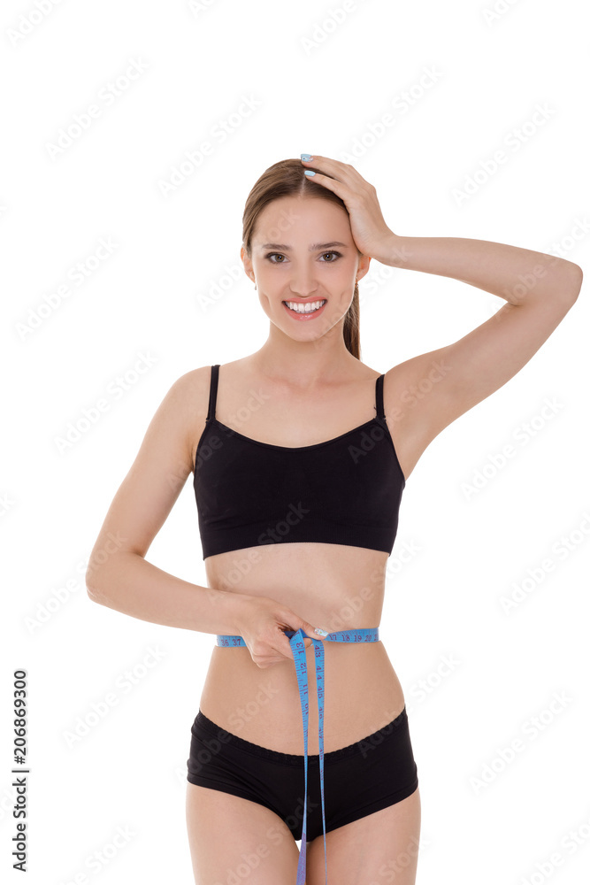 woman measuring waist with blue measuring tape. woman measuring waist with blue measuring tape.