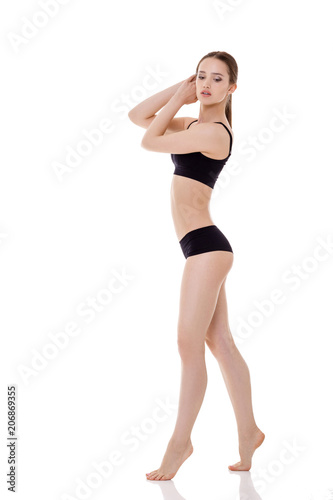 woman with perfect sporty body in black lingerie