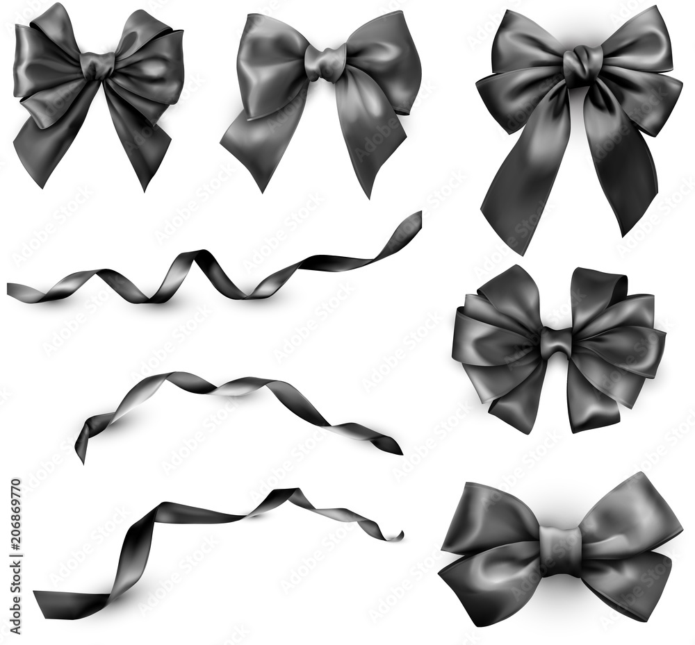 Naklejka premium Black realistic satin bows and ribbons isolated on white.