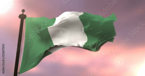 Flag of Nigeria waving at wind in slow at sunset, loop photo