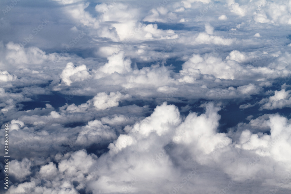 Sunrise above clouds from airplane window Sunrise above clouds from airplane window