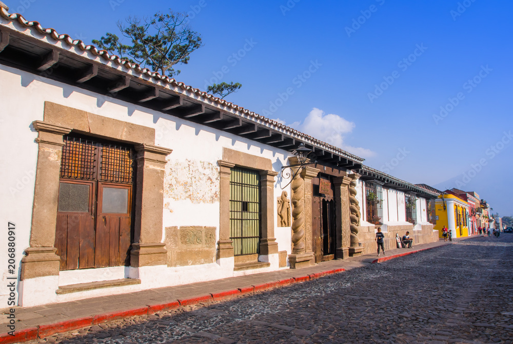 Outdoor view of stoned street with some old building houses and the historic city Antigua is UNESCO World Heritage Site since 1979 Outdoor view of stoned street with some old building houses and the historic city Antigua is UNESCO World Heritage Site since 1979