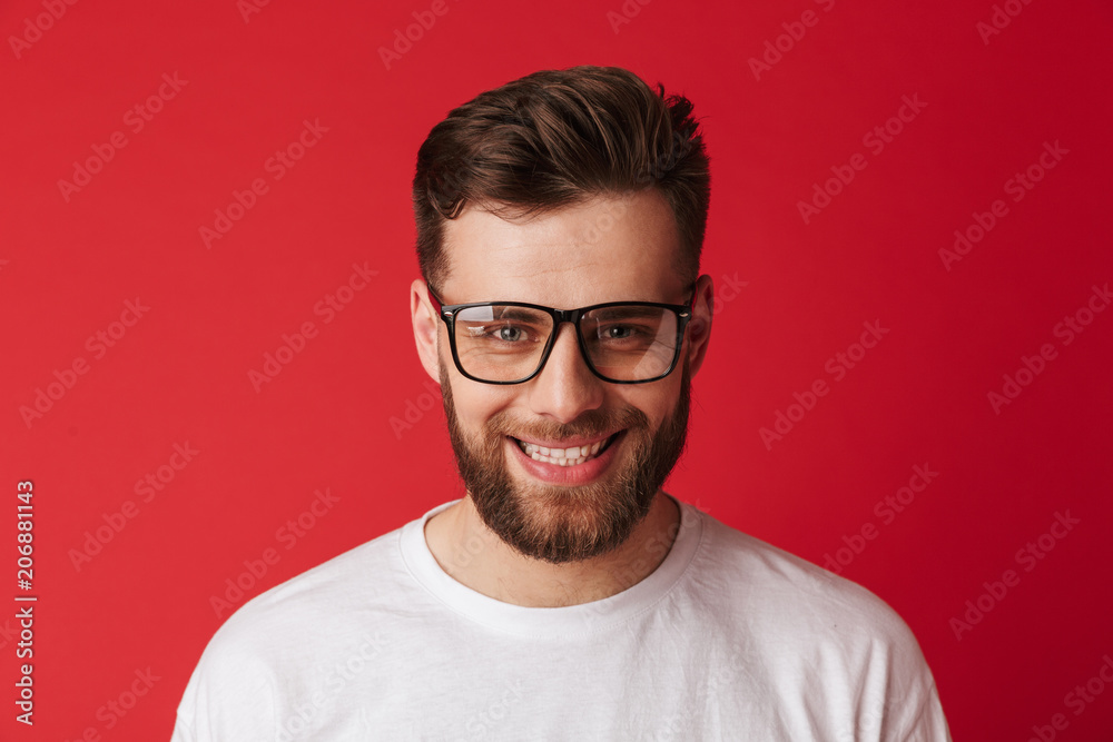 Handsome young smiling man wearing glasses