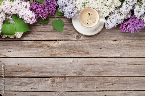 Colorful lilac flowers and coffee cup