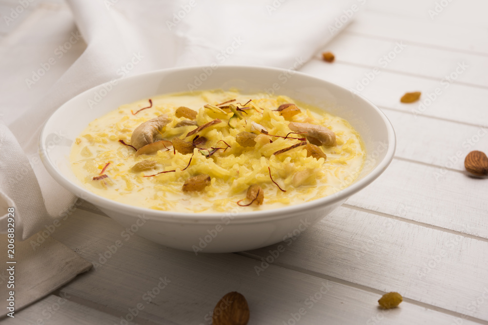Rice pudding OR Kheer from India called also called Firnee. served in a bowl. Selective focus Rice pudding OR Kheer from India called also called Firnee. served in a bowl. Selective focus