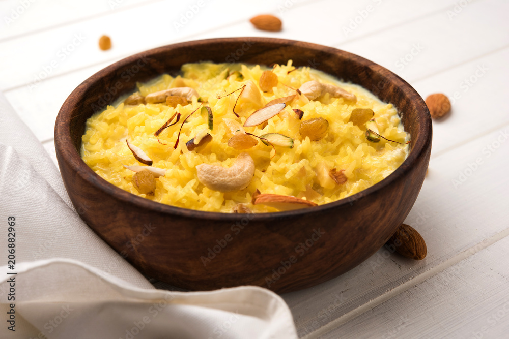 Rice pudding OR Kheer from India called also called Firnee. served in a bowl. Selective focus Rice pudding OR Kheer from India called also called Firnee. served in a bowl. Selective focus