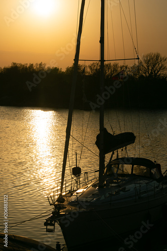 Fototapeta Naklejka Na Ścianę i Meble -  Golden sunset with a yacht