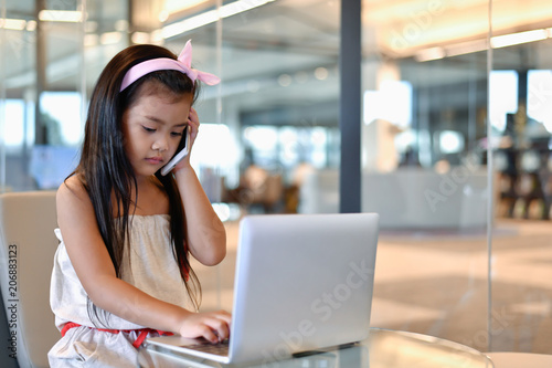 Education Concepts. The girl is studying in the library. Beautiful girls are happy learning.