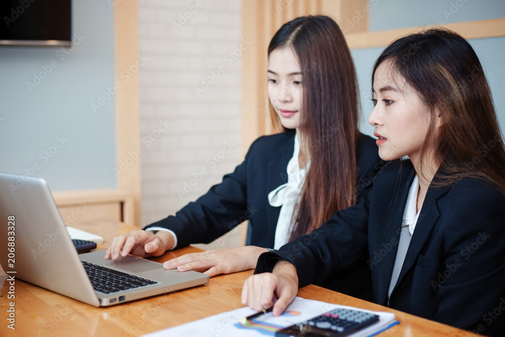 Business woman working together in the office Business woman working together in the office