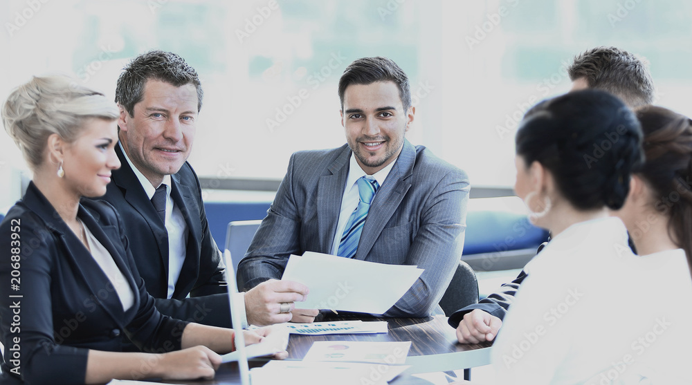 business partners and business team discussing business issues in office business partners and business team discussing business issues in office