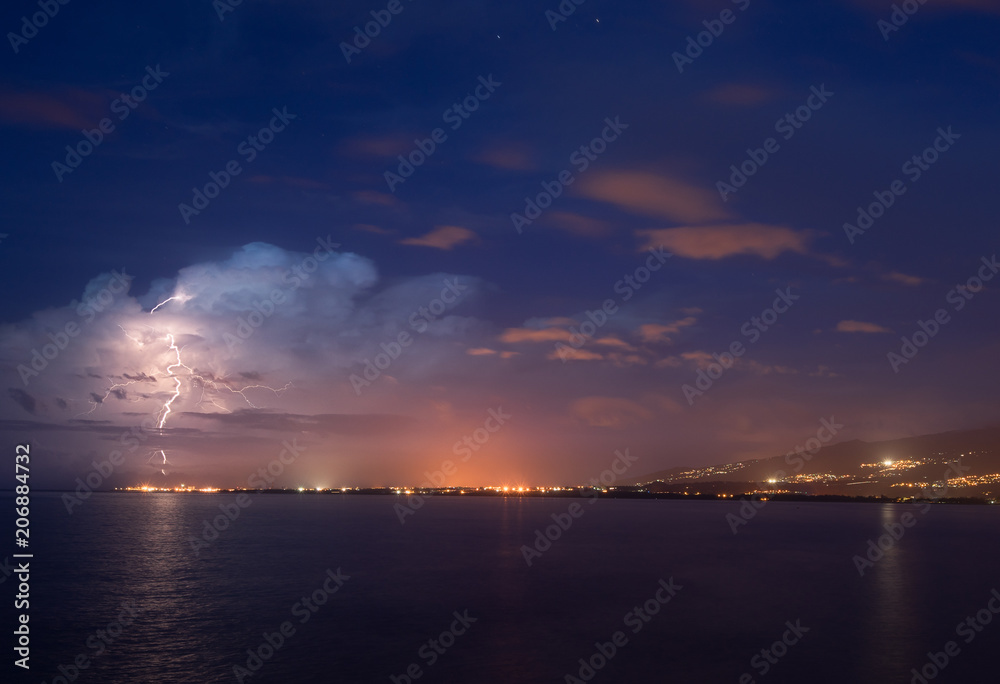 Lightning over the city of Le Port in Reunion Island