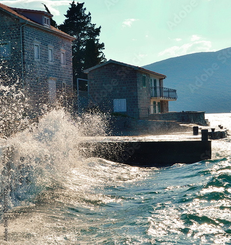 Sea water splashes stone, house, Montenegro