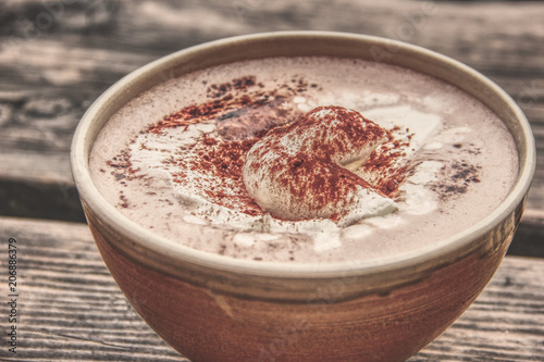 Cup Hot chocolate on an old wood plank photo