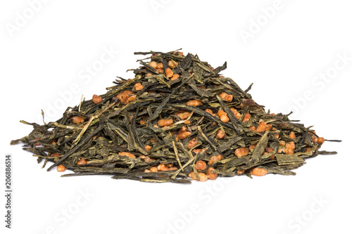 Japanese green tea Genmaicha isolated on white. Tea leaves with roasted brown rice photo