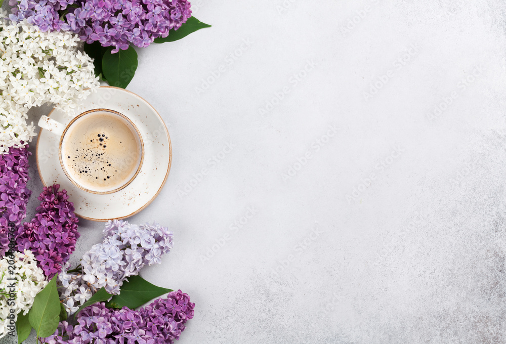 Colorful lilac flowers and coffee cup Colorful lilac flowers and coffee cup