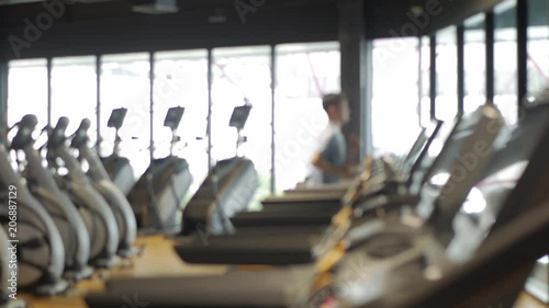 Wallpaper Mural Blurred fitness gym people cardio running workout in sport club center. Torontodigital.ca