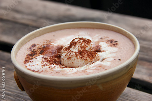 Cup Hot chocolate on an old wood plank photo