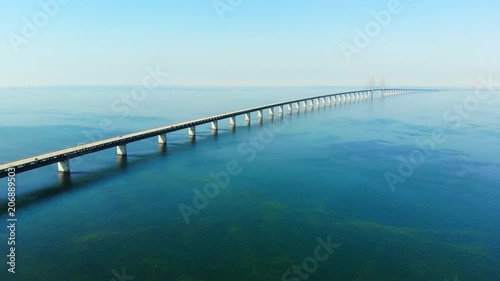 Wallpaper Mural Aerial view of modern Oresund Bridge between Denmark and Sweden (Copenhagen and Malmo), clear blue sky, seascape of Baltic Sea with diagonal composition of very long sea bridge disappearing on horizon Torontodigital.ca
