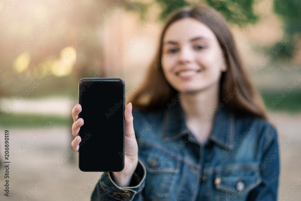 Young female girl with smartphone