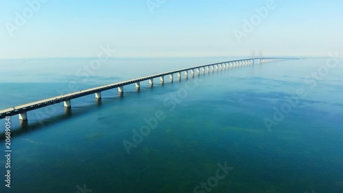 Wallpaper Mural Aerial view of modern Oresund Bridge between Denmark and Sweden (Copenhagen and Malmo), clear blue sky, seascape of Baltic Sea with diagonal composition of very long sea bridge disappearing on horizon Torontodigital.ca