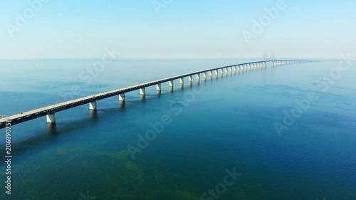 Wallpaper Mural Aerial view of modern Oresund Bridge between Denmark and Sweden (Copenhagen and Malmo), clear blue sky, seascape of Baltic Sea with diagonal composition of very long sea bridge disappearing on horizon Torontodigital.ca