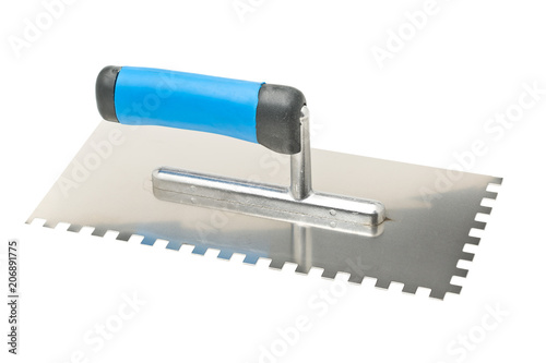 Notched trowel on white photo