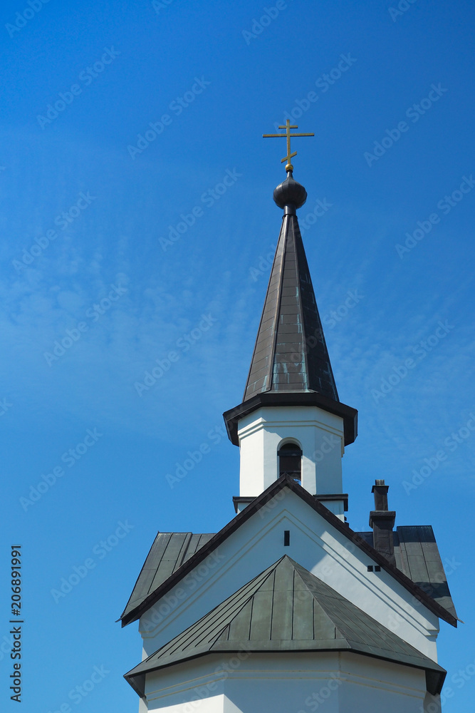 Religion background. View of the exterior of the old temple against the blue sky. Religion background. View of the exterior of the old temple against the blue sky.