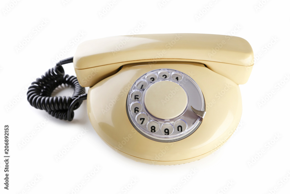 Beige retro telephone isolated on a white Beige retro telephone isolated on a white