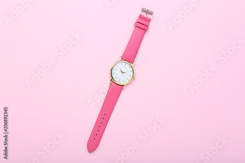 Wrist watch on pink background