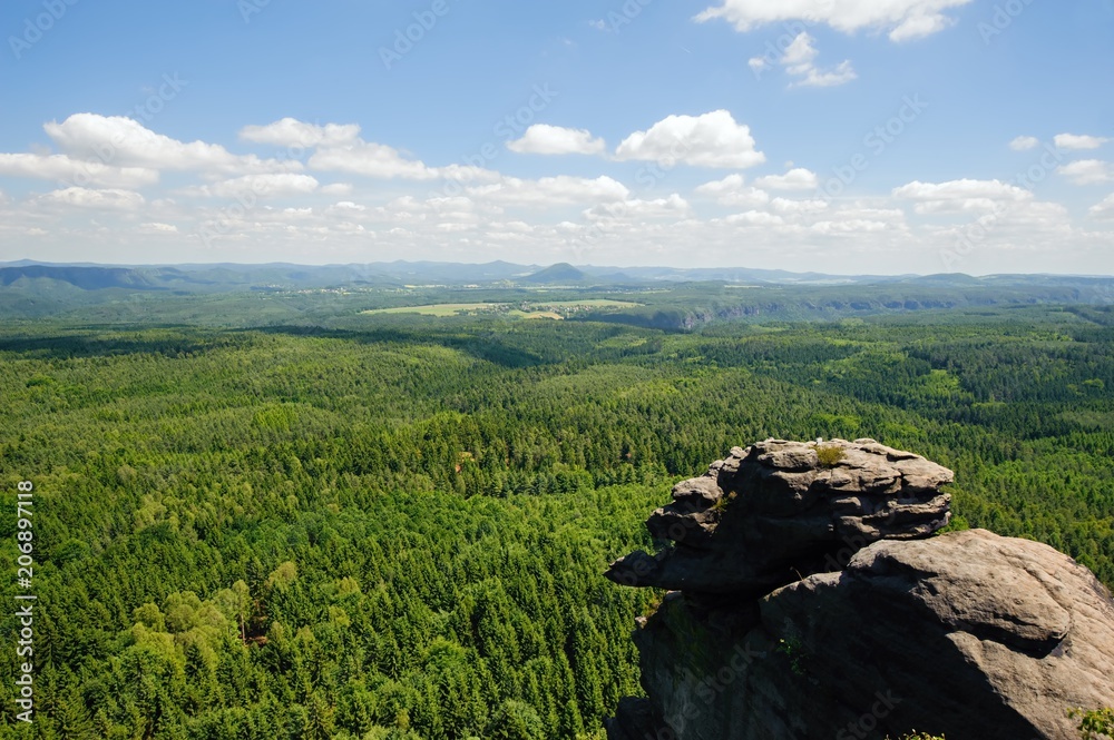 Summer landscape with forests, meadows rocks and sky