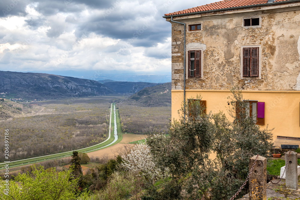 View from a The Motovun historic town on the mountainous landscape in the interior of the peninsula of Istria, Croatia, Europe. View from a The Motovun historic town on the mountainous landscape in the interior of the peninsula of Istria, Croatia, Europe.