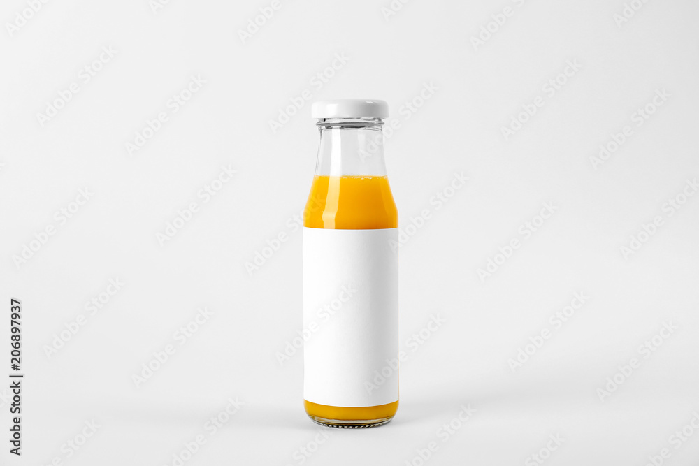 Bottle with delicious fresh juice on white background Bottle with delicious fresh juice on white background
