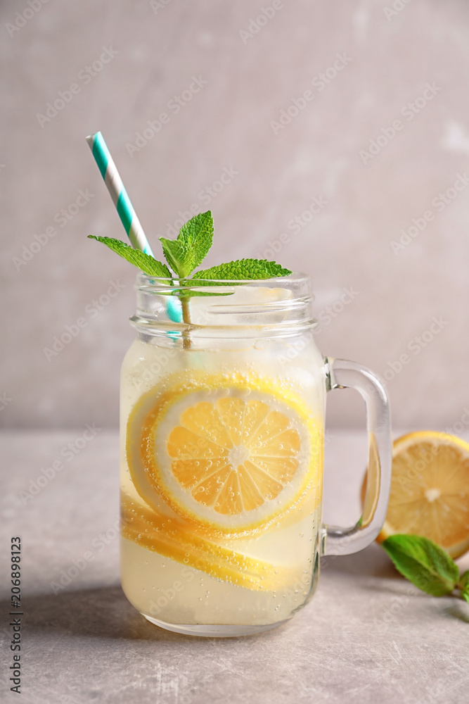 Refreshing natural lemonade in mason jar on table Refreshing natural lemonade in mason jar on table