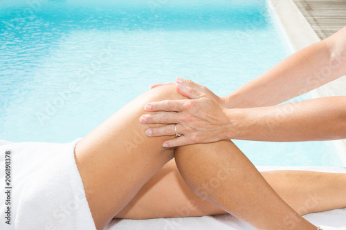 Aromatherapy Oil Leg Massage Therapy woman Masseur Massaging Sexy Young Long Female Legs girl © OceanProd