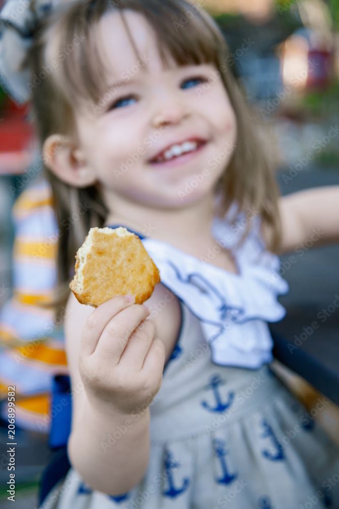 Children playing with different fruits and biscuits