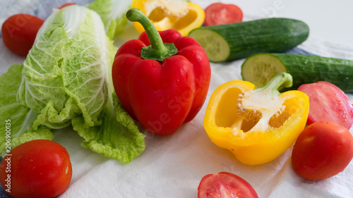 Vegetables isolated, red pepper, yellow pepper, tomatoes, cucumber and cabbage, bright food background